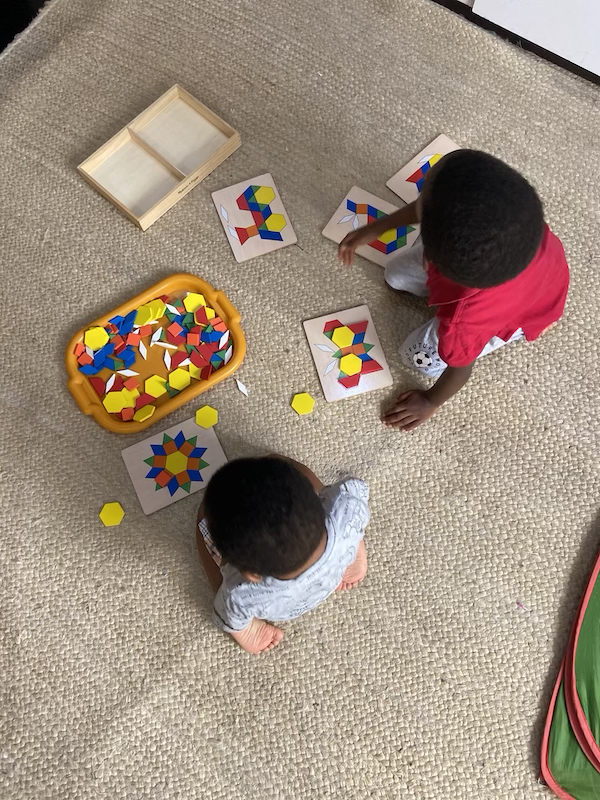 Nigerian boys playing with puzzles